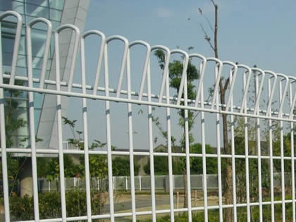 White roll top fencing offers safety protection for administrative building