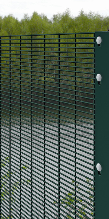 A dark green color 358 mesh fences are installed on the river bank.