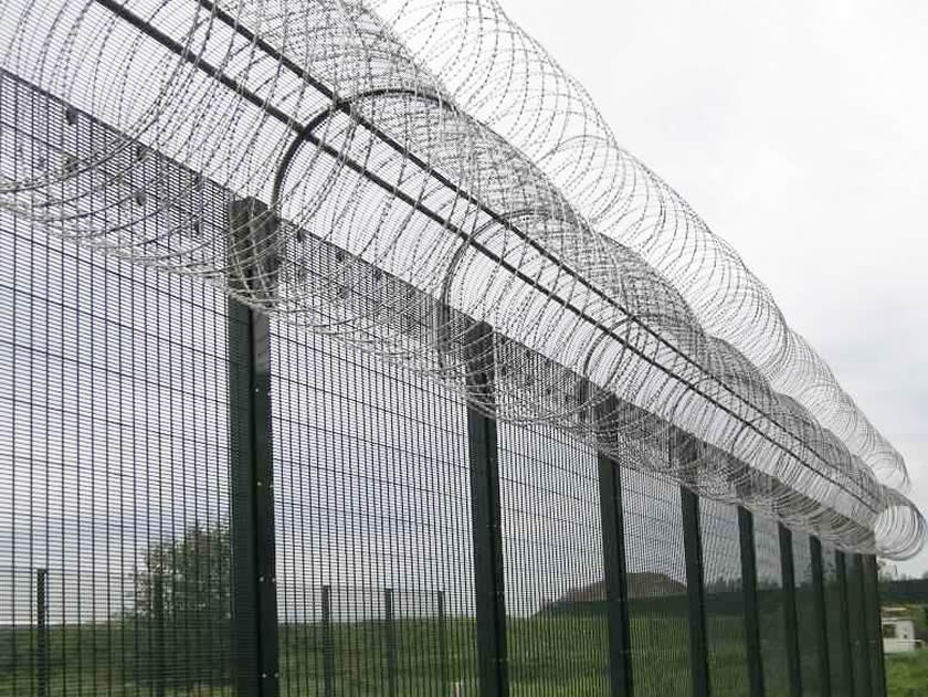 358 security fence with razor barbed wire is installed on the outdoor fields.